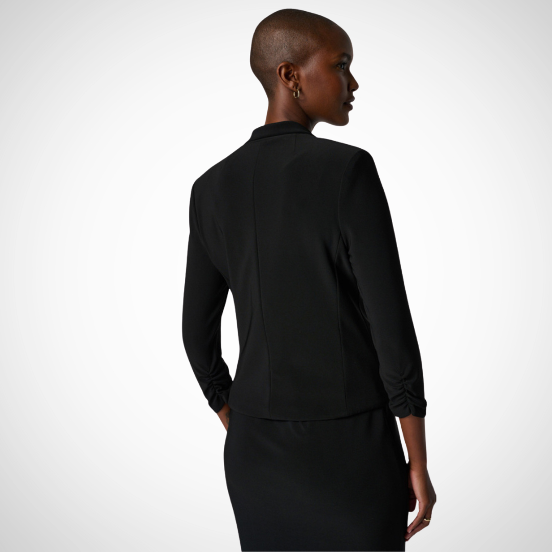  Jaboli Boutique - Fergus Ontario - Joseph Ribkoff - Classic Jacket. Joseph Ribkoff Black Cropped Tuxedo Collar Jacket Length: Hip-length Colour: Black Design: Cropped blazer with soft rounded hem Sleeves: Elbow-length Lapels: Notched Shoulders: Structured for a corporate-chic look Fabric: Silky knit Composition: 96% Polyester, 4% Spandex Style: Adds instant polish and sophistication to summer office wear