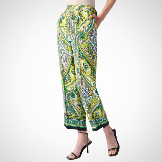 Jaboli Boutique - Fergus Ontario - Joseph Ribkoff - Cropped Paislet Pants. Joseph Ribkoff pants designed for the fashion-forward Striking paisley print in black, white, greens, and yellows Relaxed wide-leg fit Cropped design perfect for warmer weather Elasticized waistband for comfort Made with 100% polyester Includes convenient side pockets