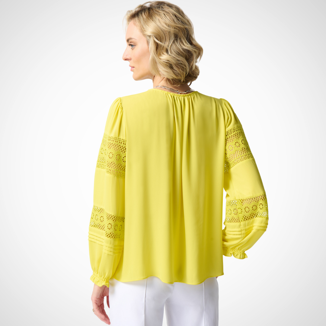 Jaboli Boutique - Fergus Ontario - Joseph Ribkoff  - Sunshine Georgette Puff Sleeve Blouse. Designer: Joseph Ribkoff Style: Bohemian elegance Neckline: Henley Color: Yellow Sunshine Sleeves: Puff sleeves with lace inserts Details: Billowy peasant top Delicate lace panels on sleeves Fabric: Lightweight for all-day comfort Occasion: Perfect for any occasion