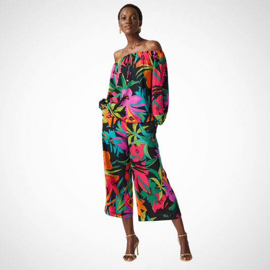Jaboli Boutique - Fergus Ontario - Joseph Ribkoff - Tropical Print Blouse - Designer: Joseph Ribkoff Fit: Relaxed Style: Off-shoulder top Print: Multi-floral hibiscus on black Features: Vibrant and bold design Loose-fit structure Pairing Options: Coordinating palazzo pants Jeans for an off-duty look Occasion: Perfect for summer style, ensures confidence and capability