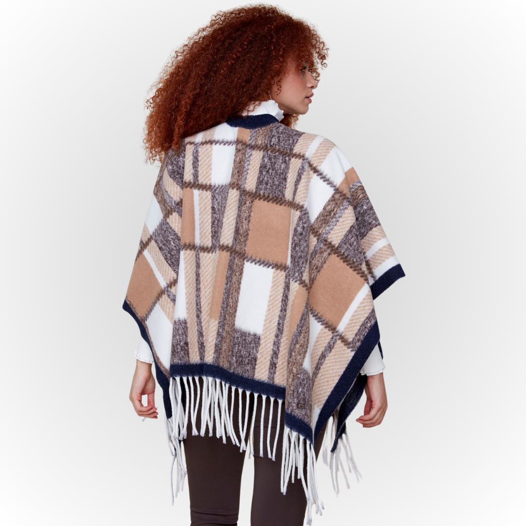 Jaboli Boutique-Fergus Ontario-Renuar-Plaid Poncho - Tan Plaid Poncho for fall Brushed knit plaid print Tan and peacock color combos Fringe hem detail Open front design Made from 100% acrylic One size fits most Stylish and cozy for crisp autumn days